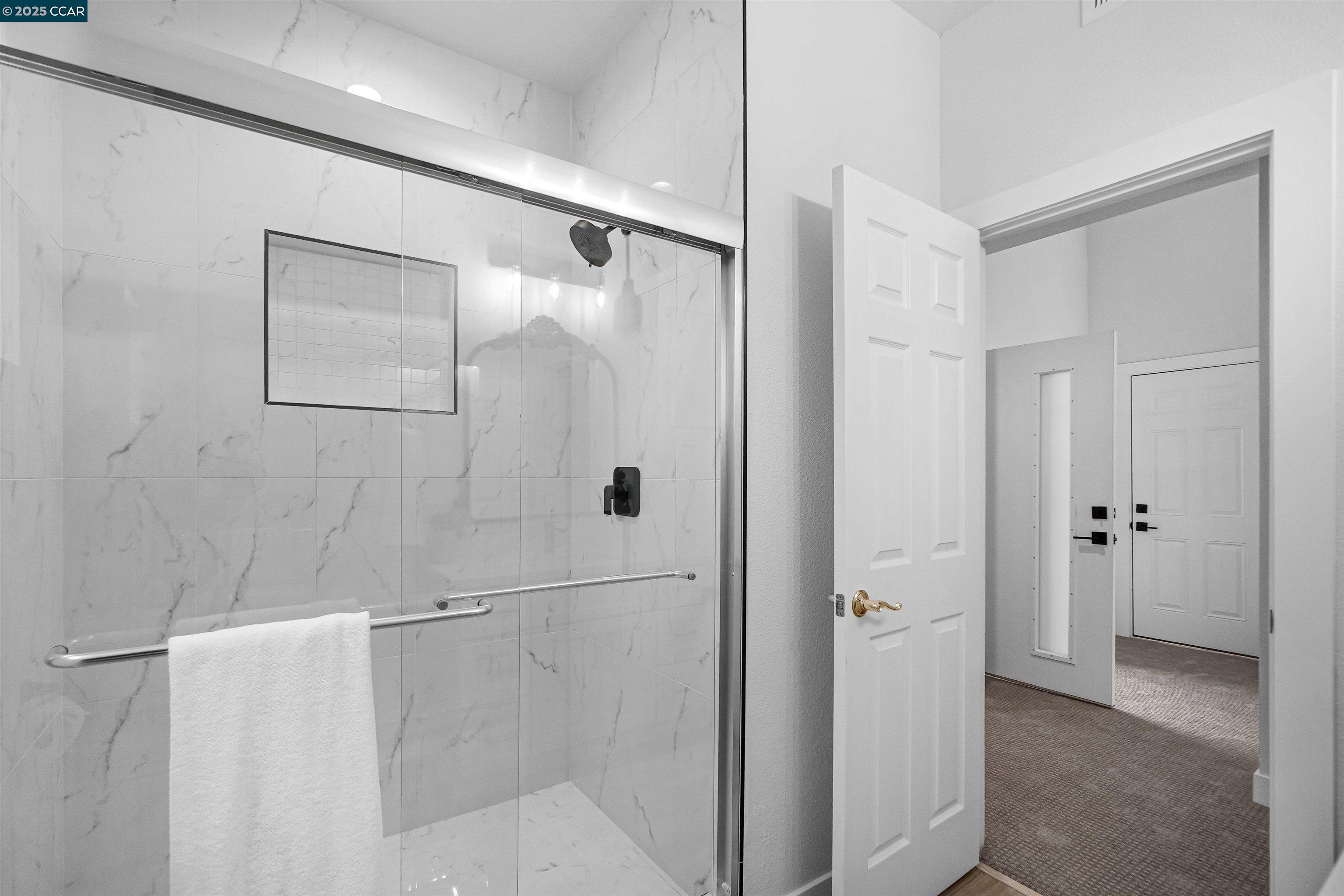 2722 Cowell Road Concord, CA 94518 - Photo 20 of 55 a bathroom with a glass shower door