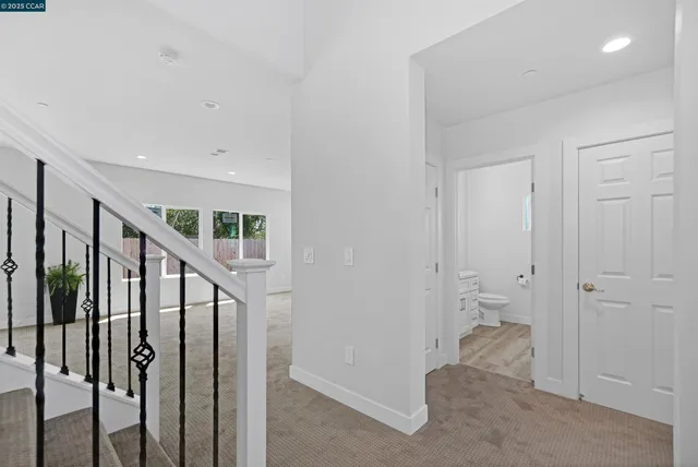 a view of hallway with wooden floor