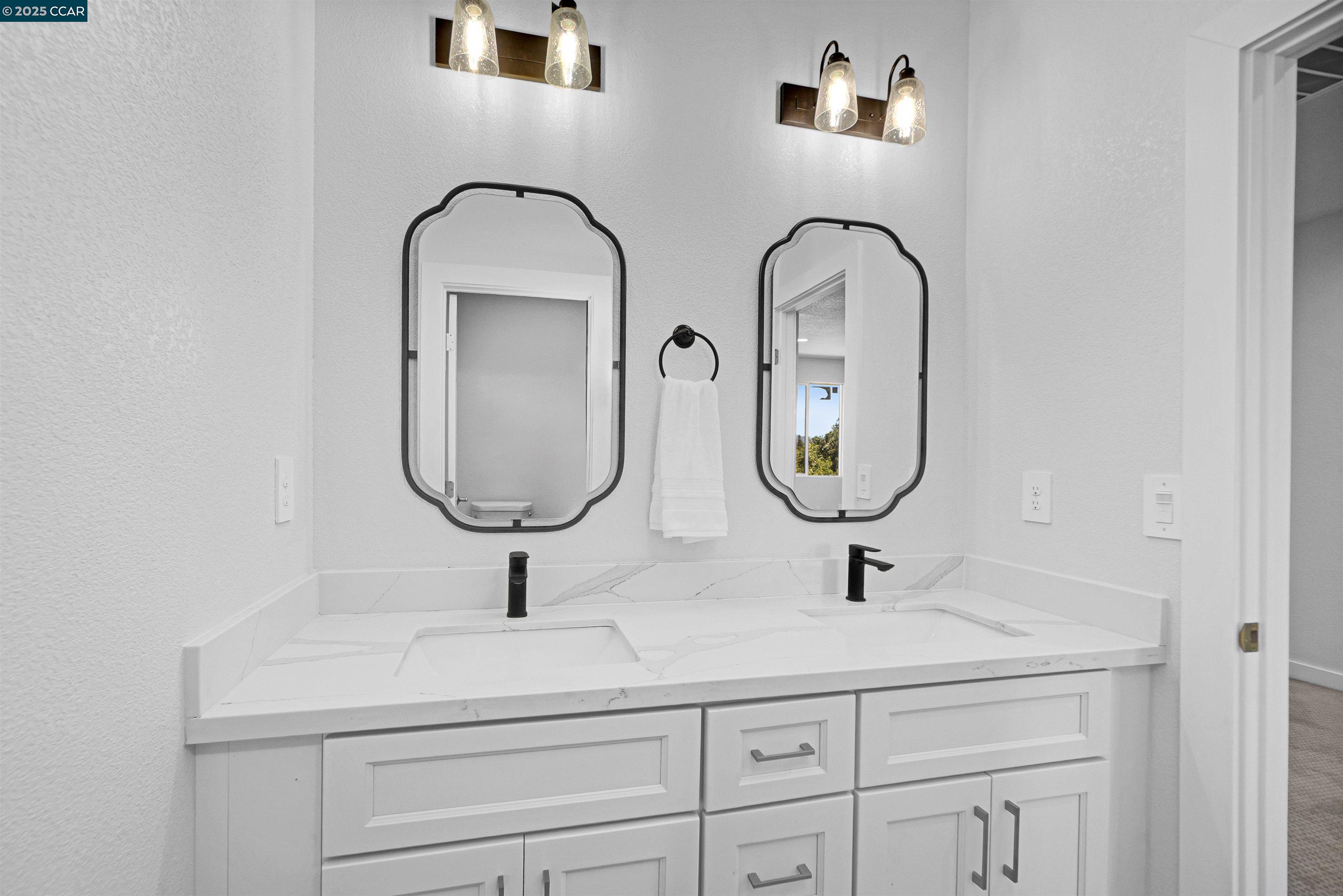 2722 Cowell Road Concord, CA 94518 - Photo 30 of 55 a bathroom with mirror and sink