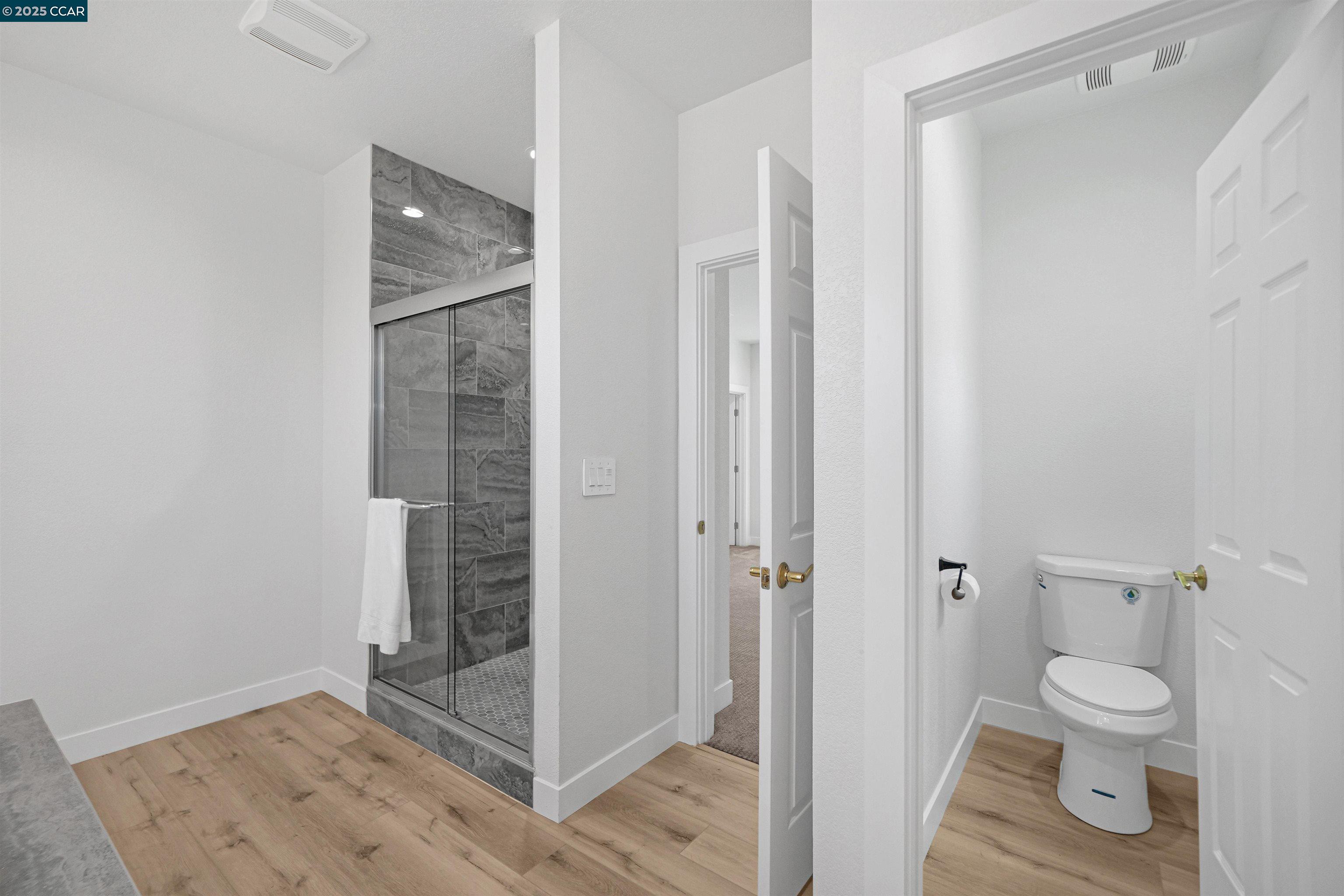 2722 Cowell Road Concord, CA 94518 - Photo 38 of 55 a bathroom with a toilet and a shower