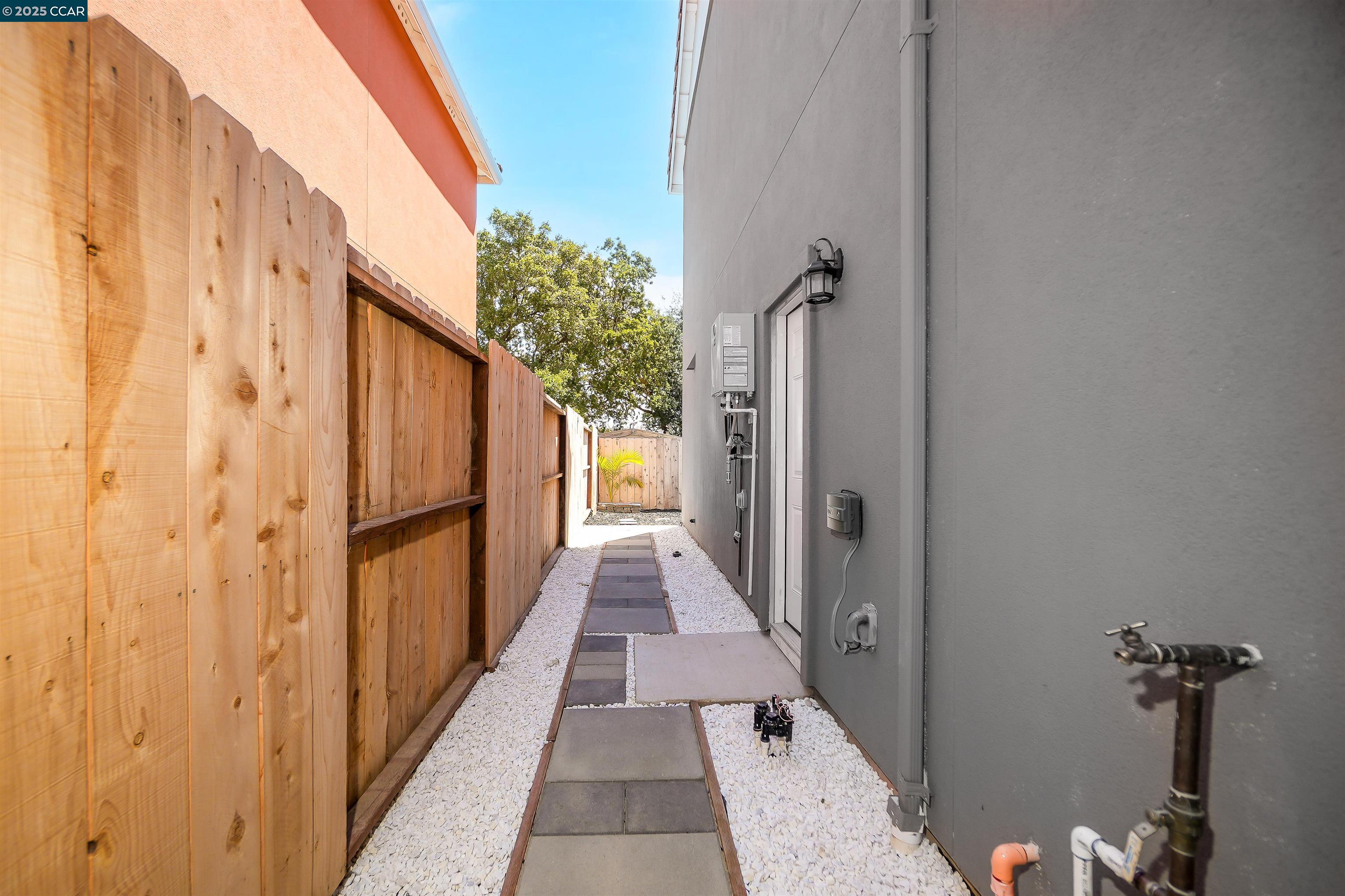 2722 Cowell Road Concord, CA 94518 - Photo 41 of 55 a view of a hallway with wooden floor and staircase