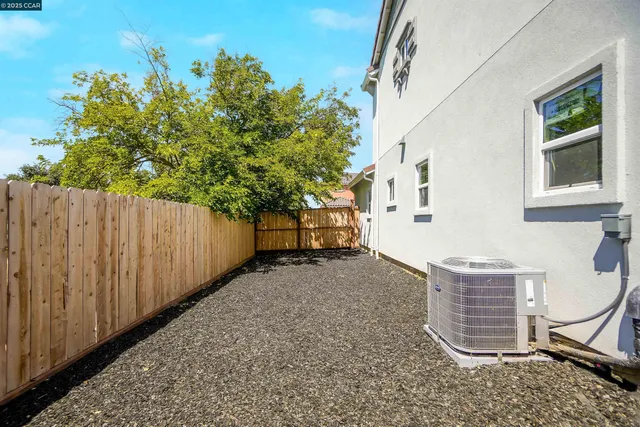 an aerial view of a house with outdoor space