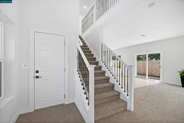 a view of a hallway with staircase