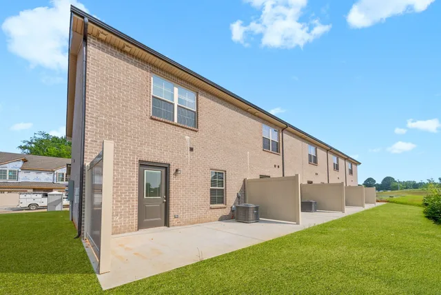 a front view of a house with a garage