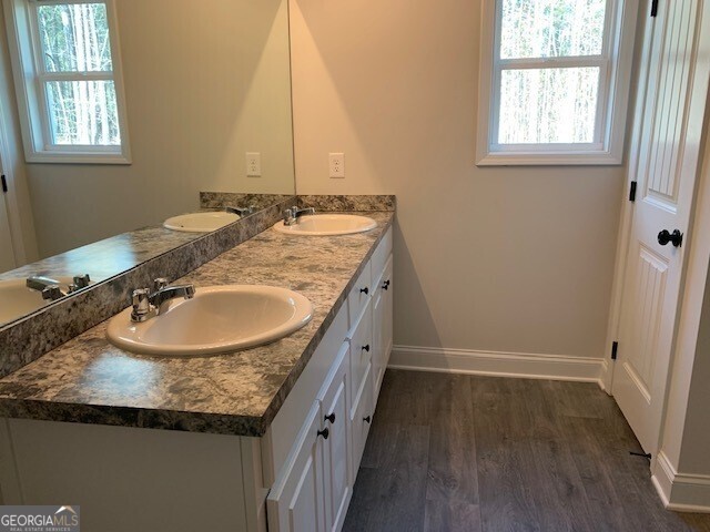 433 Riley Circle Northwest Milledgeville, GA 31061 - Photo 11 of 17 a bathroom with a granite countertop sink and a mirror