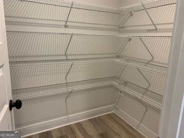 a view of a room with racks on the wall