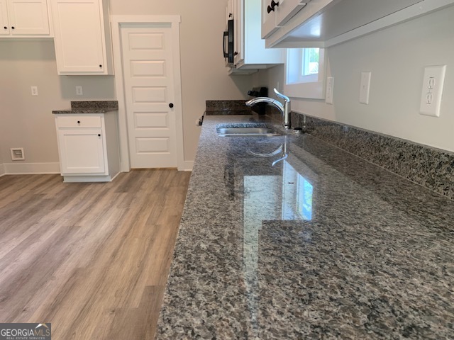 433 Riley Circle Northwest Milledgeville, GA 31061 - Photo 6 of 17 a kitchen with sink and cabinets