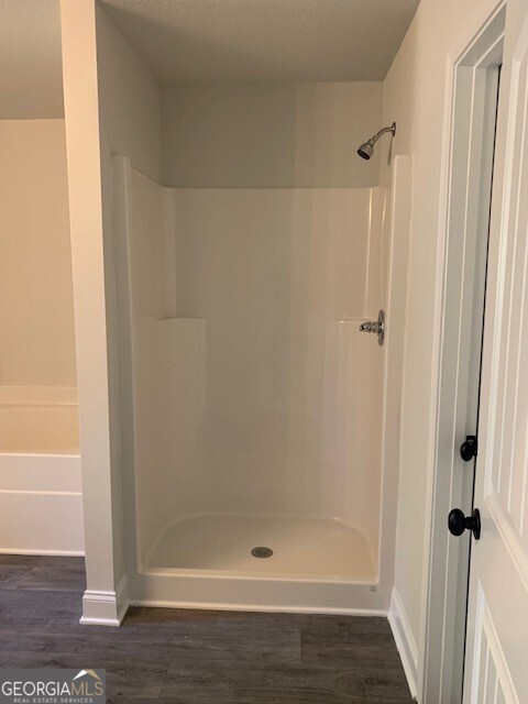 433 Riley Circle Northwest Milledgeville, GA 31061 - Photo 7 of 17 a bathroom with a glass shower door