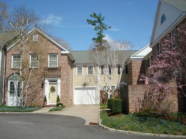 520 Main Street, Unit 12 Ridgefield, CT 06877 - Photo 1 of 1 a front view of a house with a yard