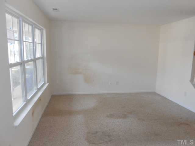 3823 Bison Hill Lane Raleigh, NC 27604 - Photo 3 of 8 a view of an empty room with a window