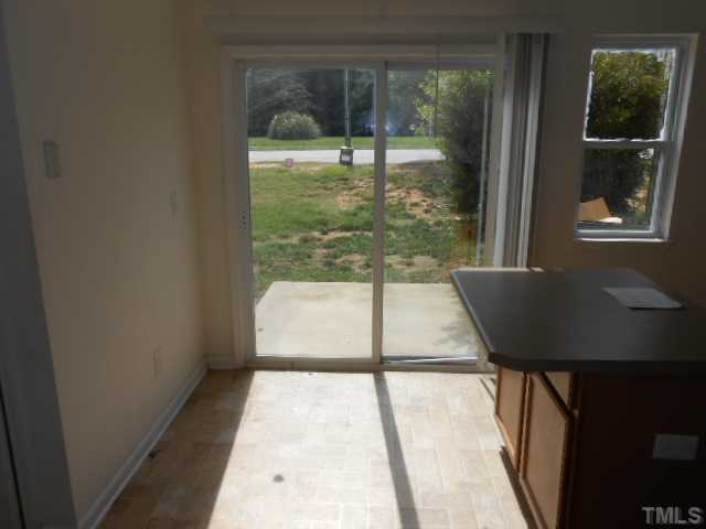 3823 Bison Hill Lane Raleigh, NC 27604 - Photo 5 of 8 a view of a room with a large window