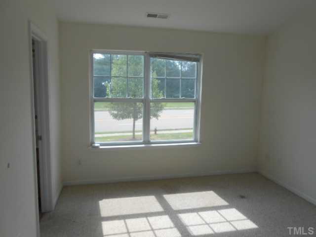 3823 Bison Hill Lane Raleigh, NC 27604 - Photo 6 of 8 an empty room with windows