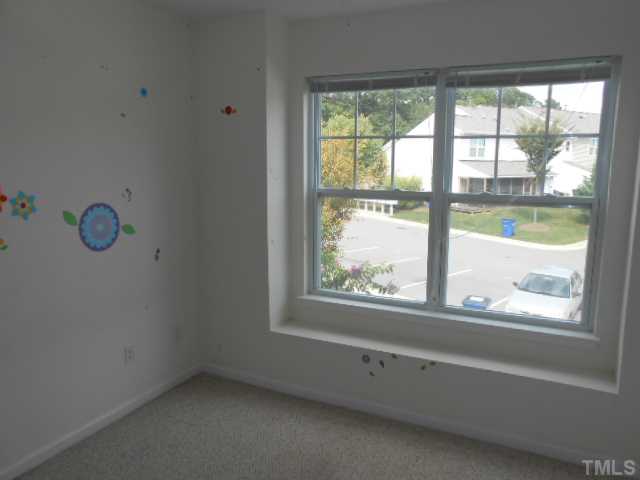 3823 Bison Hill Lane Raleigh, NC 27604 - Photo 7 of 8 an empty room with a window