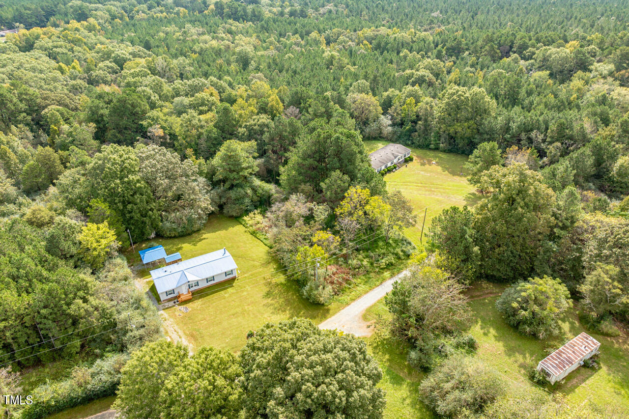 401 Major Lee Road Pittsboro, NC 27312 - Photo 20 of 23 a view of a yard with large trees