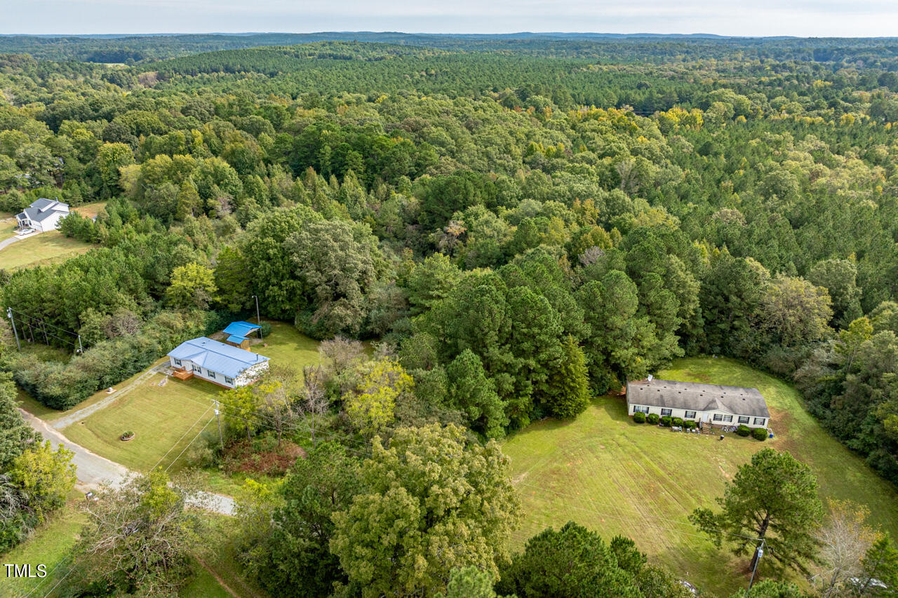 401 Major Lee Road Pittsboro, NC 27312 - Photo 22 of 23 a view of a yard with table and chairs
