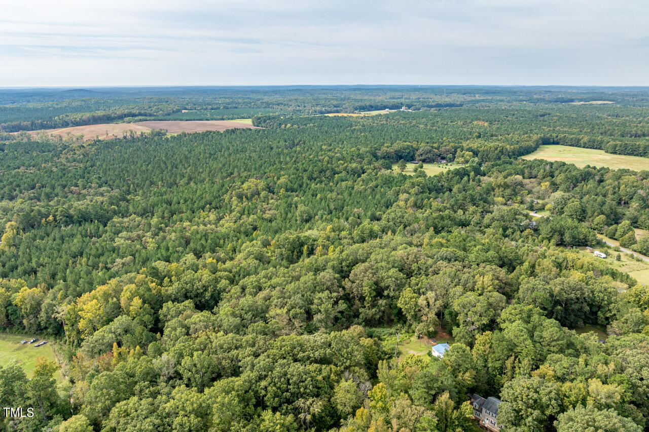 401 Major Lee Road Pittsboro, NC 27312 - Photo 7 of 23 an aerial view of residential houses with outdoor space and trees