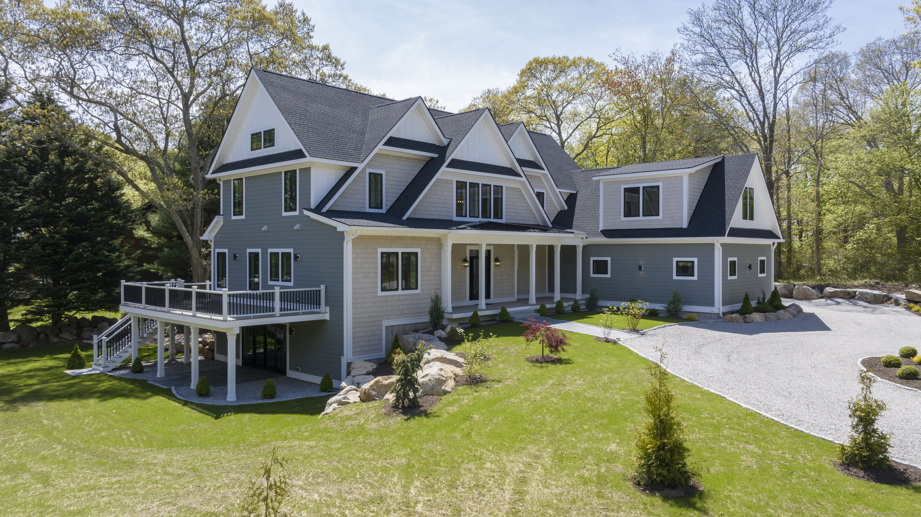 a aerial view of a house with swimming pool next to a yard