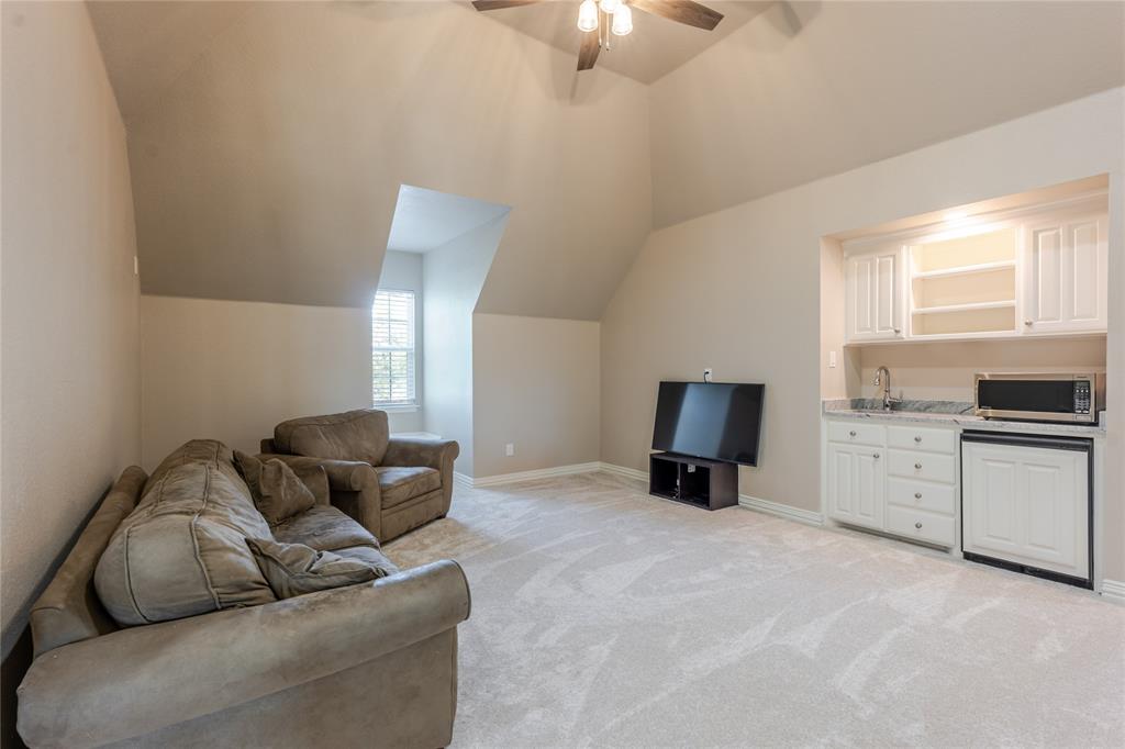 166 East Rio Ridge Azle, TX 76020 - Photo 28 of 40 a living room with furniture and a flat screen tv