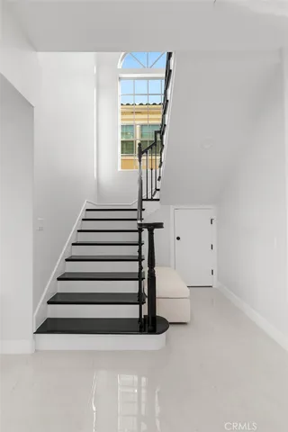 a sink with cabinets and window