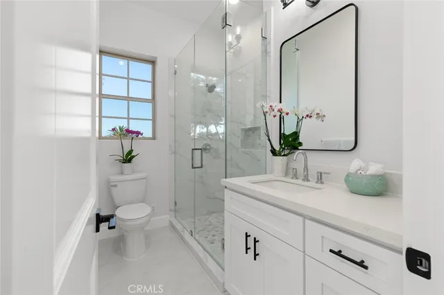 a bedroom with a bed and a sink