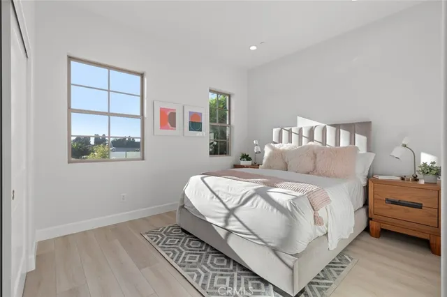 a bedroom with a bed and a couch