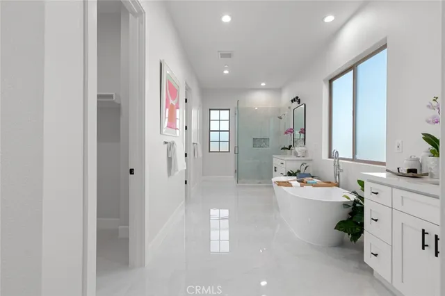 a bathroom with a shower sink and mirror