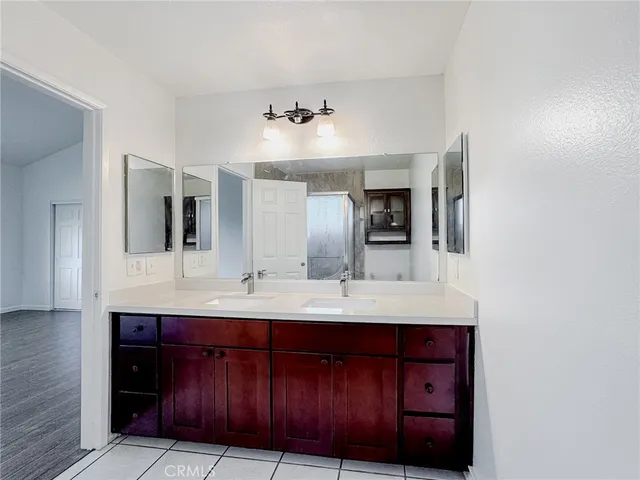 a bathroom with a sink a vanity and a mirror