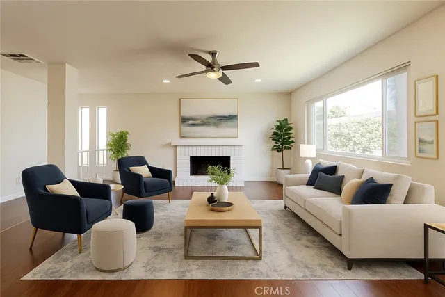 a living room with furniture fireplace and window