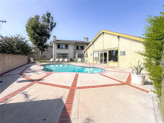 a view of swimming pool with a yard