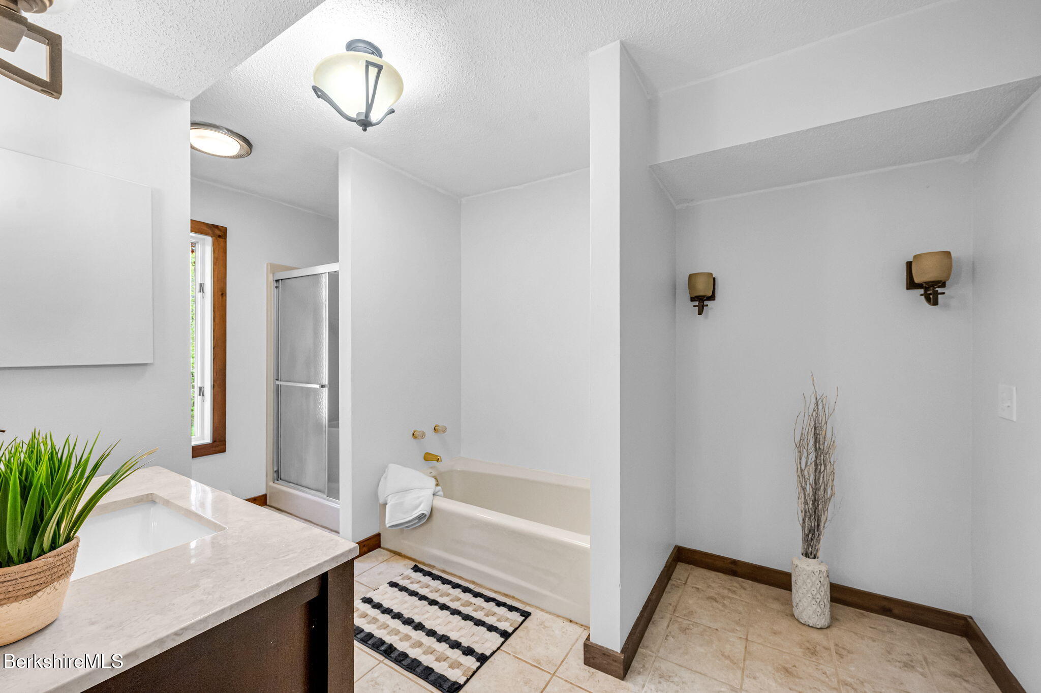 1874 Home Road Sheffield, MA 01230 - Photo 37 of 42 a bathroom with a sink a mirror and a shower