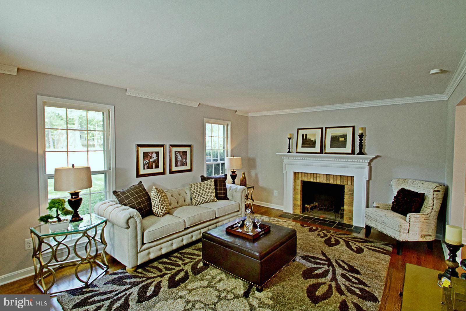 1321 Deep Run Lane Reston, VA 20190 - Photo 3 of 30 a living room with furniture and a fireplace