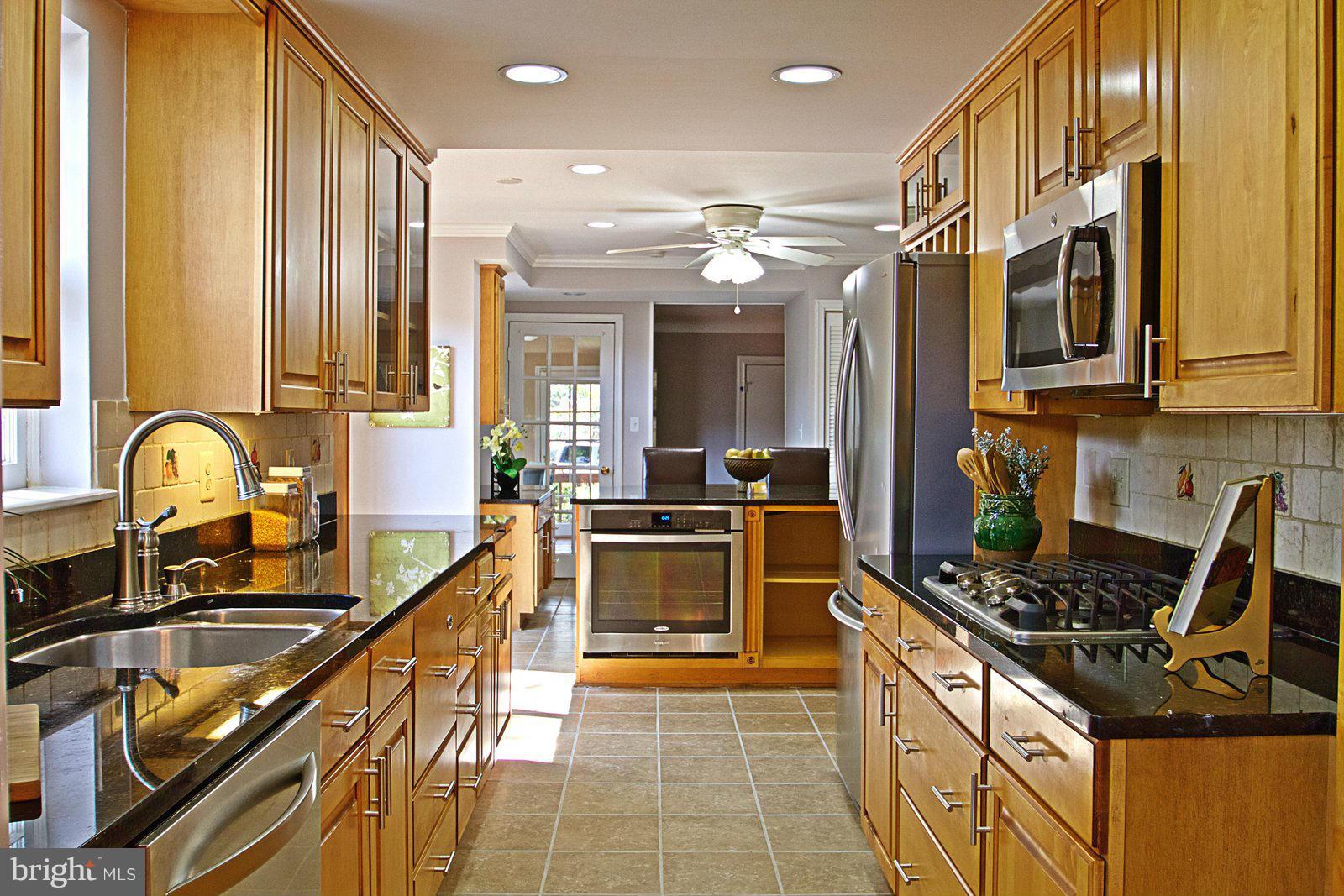 1321 Deep Run Lane Reston, VA 20190 - Photo 8 of 30 a kitchen with stainless steel appliances a stove a sink and a microwave