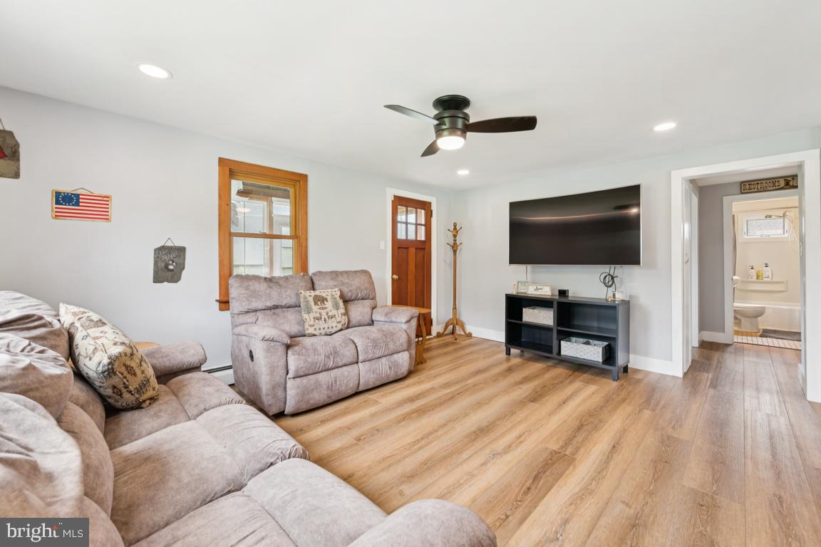 26 Hilliards Bridge Road Southampton, NJ 08088 - Photo 8 of 24 a living room with furniture and a flat screen tv