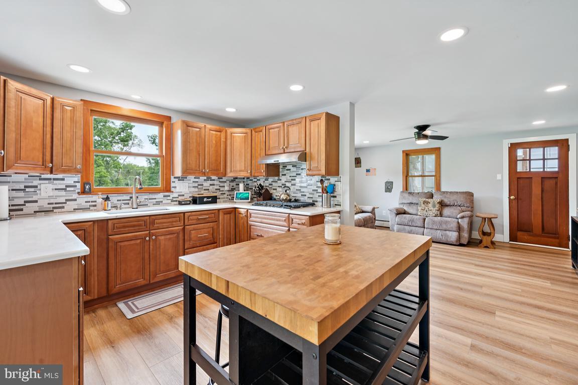 26 Hilliards Bridge Road Southampton, NJ 08088 - Photo 9 of 24 a kitchen with a table chairs sink and cabinets