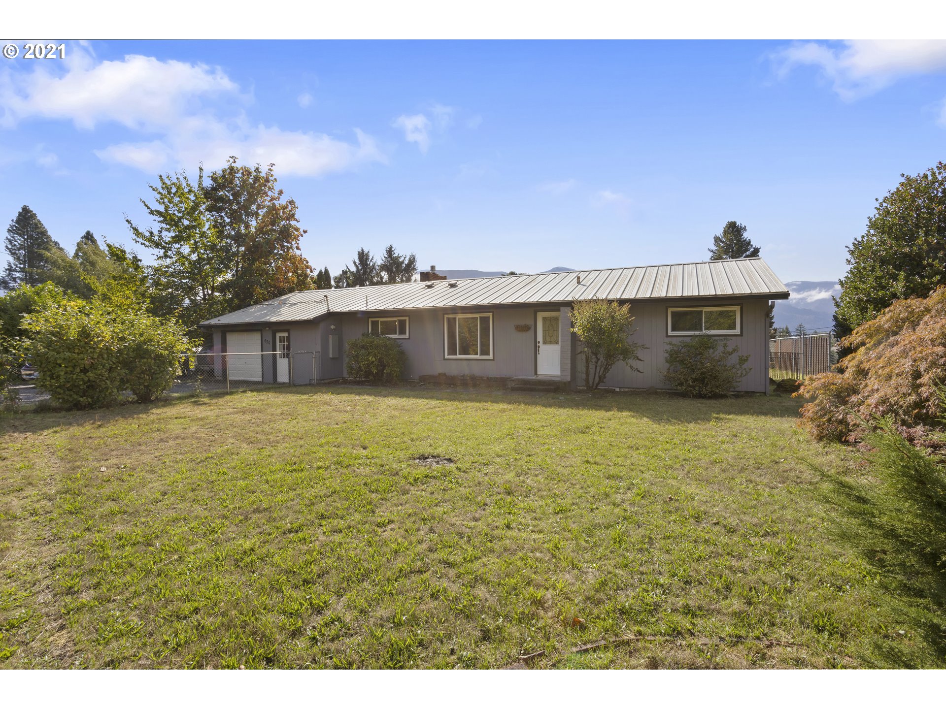 630 Northwest Gropper Road Stevenson, WA 98648 - Photo 1 of 21 a front view of a house with a garden