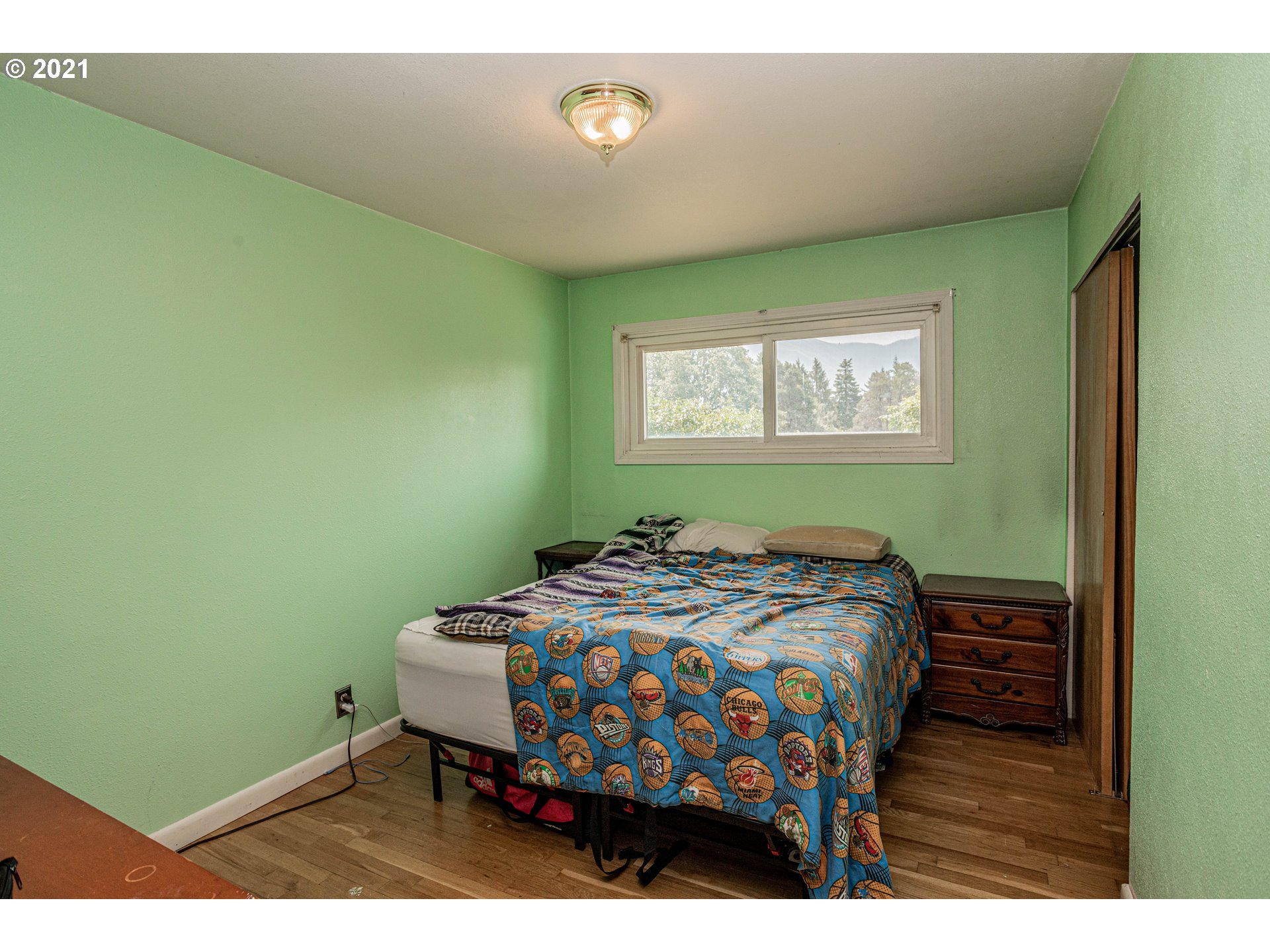 630 Northwest Gropper Road Stevenson, WA 98648 - Photo 16 of 21 a bedroom with a bed and a window