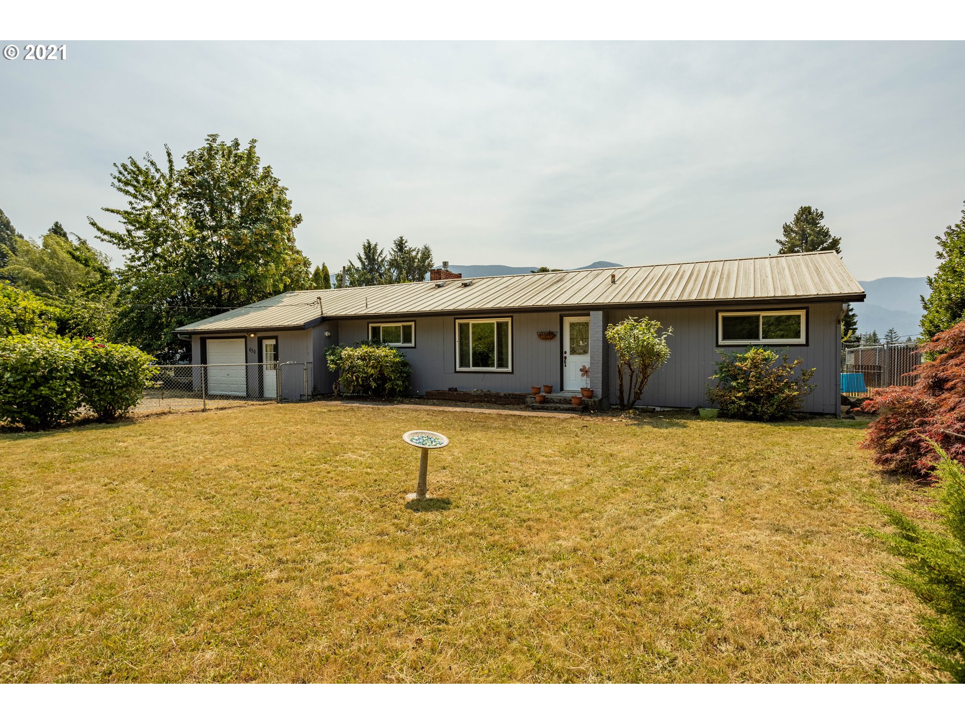 630 Northwest Gropper Road Stevenson, WA 98648 - Photo 21 of 21 a view of a house with a backyard