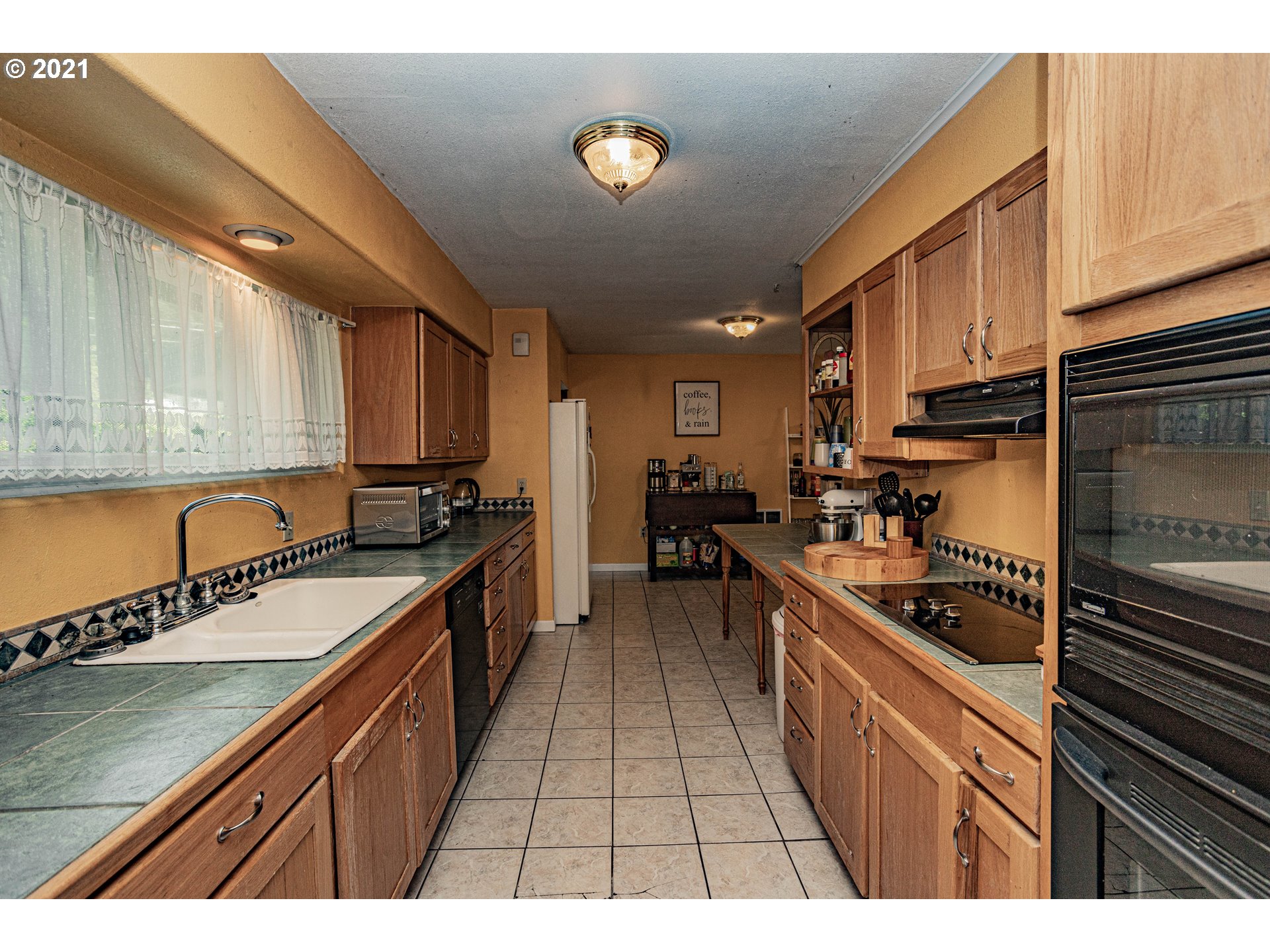 630 Northwest Gropper Road Stevenson, WA 98648 - Photo 8 of 21 a kitchen with stainless steel appliances granite countertop a sink a stove and a refrigerator
