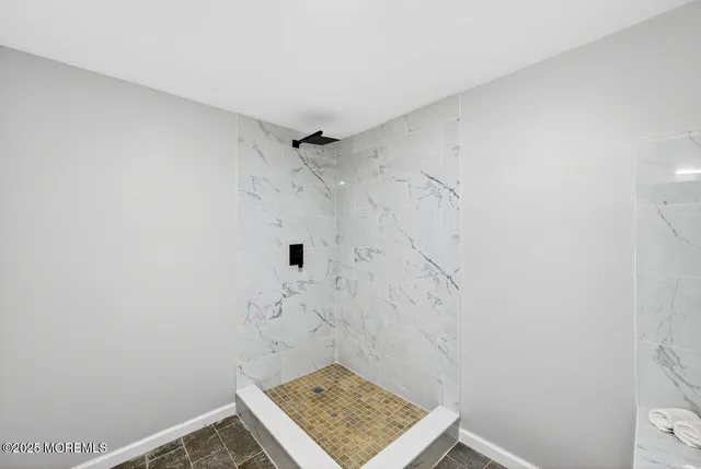 a bathroom with a sink toilet and mirror