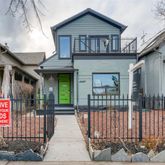 a front view of a house with glass windows and door