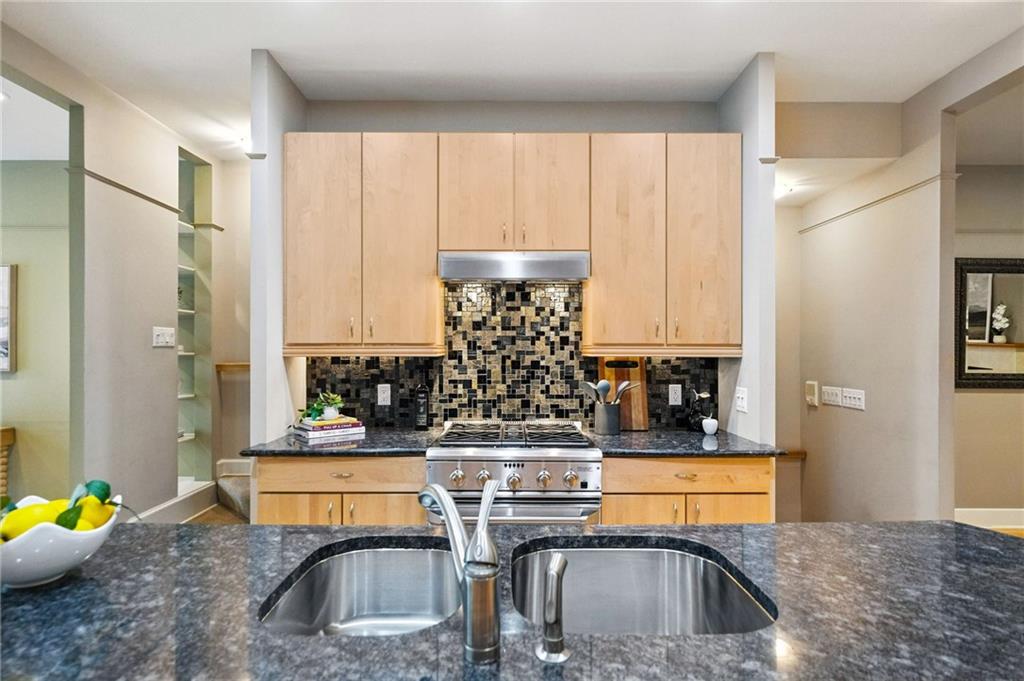140 North Woodland Road Pittsburgh, PA 15232 - Photo 11 of 38 a kitchen with stainless steel appliances granite countertop a sink refrigerator and cabinets