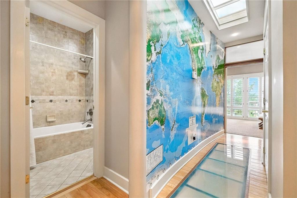 140 North Woodland Road Pittsburgh, PA 15232 - Photo 15 of 38 a bathroom with a glass shower door and a bathtub