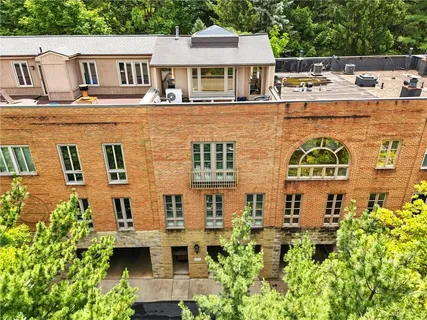 a view of a patio with table and chairs and potted plants