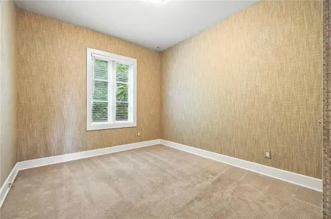 a white toilet sitting next to a bath tub