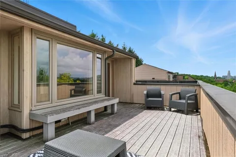 a view of a city with tall trees