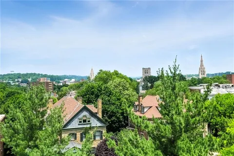 a view of balcony and wooden fence
