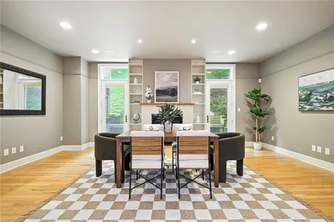 a view of a dining room with furniture window and wooden floor