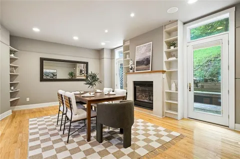 a dining room with a table and chairs