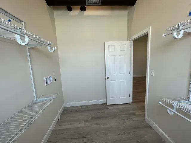 a view of small space with racks on the wall