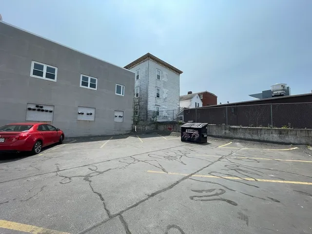 a front view of a house with parking